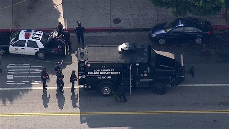 3 officers shot in east Los Angeles; suspect barricaded