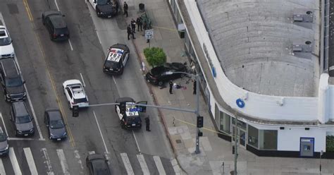 3 people hospitalized after car jumps curb, crashes into Chase Bank building 