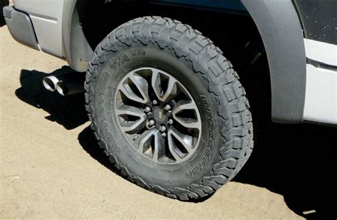 The tire size 305/70R18 can be expressed in inches as approximately 12 inches wide, 8.4 inches tall in sidewall, and designed to fit a 18 -inch wheel rim. This equates to a tire height of 34.8 inches. The 305/70R18 also has a circumference of 109.4 inches and It completes 579.4 revolutions per mile.. 
