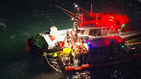 4 rescued after boat overturns at Port Miami