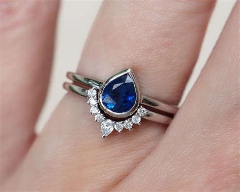 4.10 Carat Pear Blue Sapphire Halo Engagement Ring September