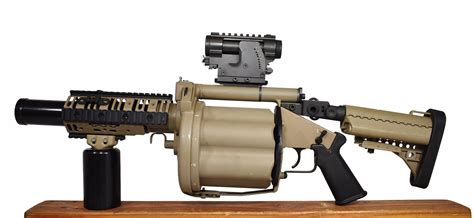 It can fire a variety of 40mm grenades. The M430 HEDP 40mm grenade will pierce armor up to 2 inches thick, ... The first version was a hand-cranked multiple grenade launcher called the MK 18. In 1966, the need for more fire power inspired the development of a self-powered 40-mm machine gun called the MK 19 MOD 0.. 