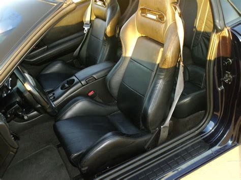 A buddy of mine had a 97 Camaro SS 30th Anniversary convertible (pretty rare). He was running low 10's and needed the roll bar and 5-point harness. So he had the headrest portion of the Camaro seat (headrests are integral, not separate like the Firebird seats) cut and reconstructed with matching white leather to accomodate the Y-type shoulder .... 