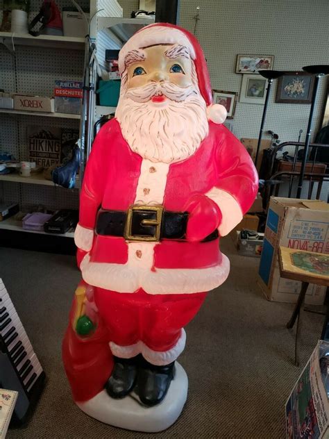 largest selection of vintage blow molds and vintage xmas decor and collectibles in the midwest-stainless aluminum 1960's trees and balls and pixies galore ! ... and mini,candy canes and lolli pops, lanterns and candles-toy soldiers, drummer boys, nut crackers, english bobbys--5 foot santa and even a polks. ... and winged angels-nativity stars ...