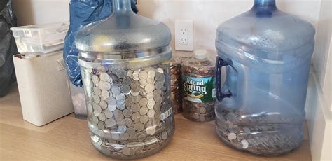 5 gallon bucket of quarters worth. Volume of a US gallon = 3785.41178 cm3. Dividing the jug volume by the quarter's volume we get. 3785.41178 / 0.80893 = slightly less than 4680 quarters ($1170 USD). One test using a 5-gallon jug provided a ballpark figure of $5200, so an actual experimental value would be closer to 4160 quarters. ($1040 USD) (see related question) 