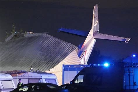 5 people killed and 8 injured in Poland when a small plane crashes into a hangar during bad weather