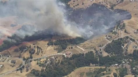 60-acre fire threatening structures in South Bay