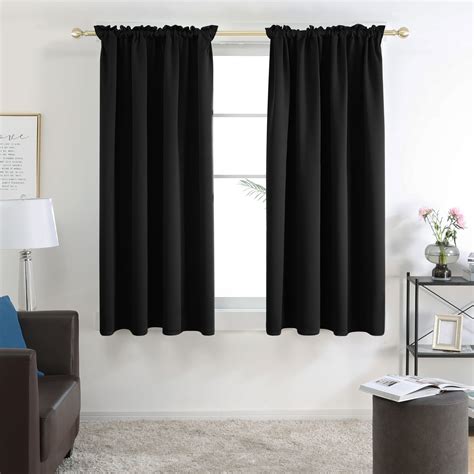 KOUFALL Black Blackout Curtains 63 Inch Length for Bedroom,Thermal Insulated Grommet 2 Panels Ringed Blocking Light Dimming Pitch Dark Thick Black Out Cover Darkening Window Curtain 63 Inches Long. 4.6 out of 5 stars 6,808. 100+ bought in past month. $17.99 $ 17. 99.. 