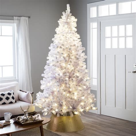 Holiday Living Everett Grand 7.5-ft Fraser Fir Pre-lit Artificial Christmas Tree with LED Lights. Add a touch of sophistication to your holiday decorating. At 7.5-ft tall and a 62-in diameter this tree is very full and adorn with 1200 warm white/multicolor LED lights with 9 functions. emitting elegance and boasting 3189 branch tips, this gorgeous full shaped …. 