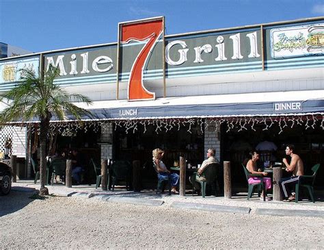 7 mile grill. Inside, 7 Mile looks a lot like it does on the outside: funky, dimply lit, and rough around the edges. But even at 5:15 on a Weds it was busy inside. Found a spot at the bar to have a drink and order dinner. They have a wide variety of typical bar foods and some not so typical bar foods. Something for everyone. 