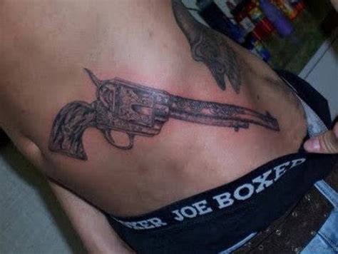 71 Stylish Gun Tattoos For Waist Tattoo Designs
