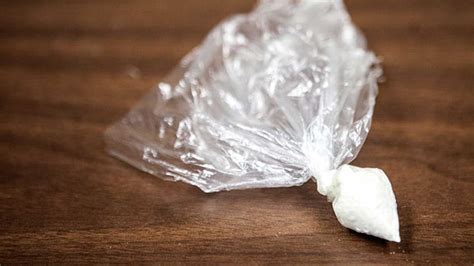 8 ball of cocaine. The term “8-ball” is slang referring to a specific quantity of a drug, most often cocaine. (1) An 8-ball is one-eighth of an ounce or approximately 3.5 grams of cocaine. An 8-ball of powder cocaine is typically packaged in thin plastic, which, when wrapped tightly, often forms a ball-like shape. 