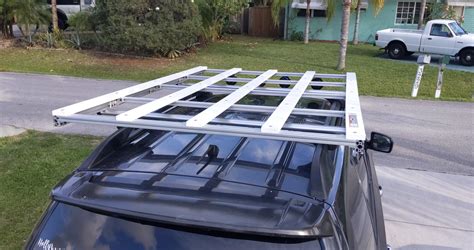 Have you made any progress on your roof rack? With 80/20? The only rack I've ever liked very much (Flat Line Van) is overpriced ~$1300 and I realized recently I could likely build a 80/20 rack which I can expand for a second solar panel level at some point. Did you build your entire rack with 80/20 or just the rails? Please/thanks!. 