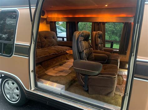 The VW bus interior features two benches 