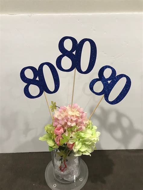 80th birthday centerpiece ideas. Check out 20+ creative photo centerpieces, photo collage ideas, and picture display ideas! ... Birthday Party Decorations For Adults. 75th Birthday Parties. 