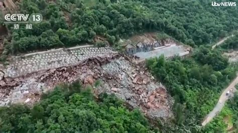 9 missing in China landslide sparked by heavy rains amid flooding and searing temperatures