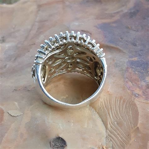 925 cn ring. Sterling Silver (aka S. Silver, 925, or .925 Silver): This type of silver contains 92.5% pure silver, with the remaining 7.5% being other metals that help to enhance its hardness and durability. Vermeil: This type of silver jewelry contains a gold layer over sterling silver as the base metal. 