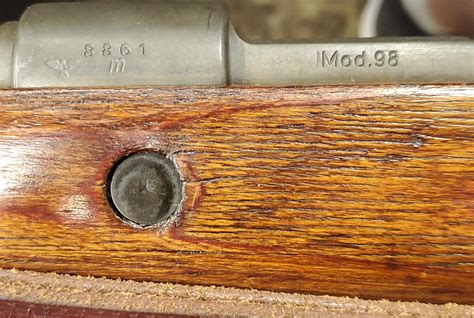 I'm also curious to find out if this is an all original rifle or a bit of a "frankenstein". Some of the markings match up and some seem to be random. There is one marking that seems to be repeated that I refer to as the "crown symbol". Photos are added in below. Thank you! 1 - full size 2 - full size #2 BARREL 3 - "Gew. 98" 4 - "13028" & …