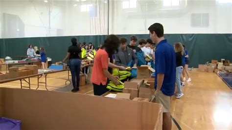 9th graders from Nova University School in Davie pack 2,000 backpacks with essential supplies for children in need
