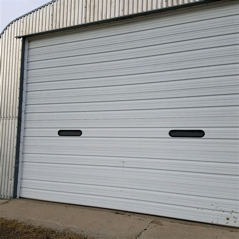 9x10 garage door. A double 16' x 8' garage door costs $600 to $1,200. A 10' x 10' roll-up garage door costs $450 to $2,100. Installation adds $150 to $700. Basic overhead garage doors cost $250 to $800 for sectional aluminum or steel. Insulated, roll-up, and made-to-measure garage doors cost $800 to $4,000 in wood, glass, fiberglass, or steel. 