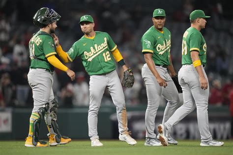 A’s hit 5 home runs, rally for 11-10 win over Angels in 10