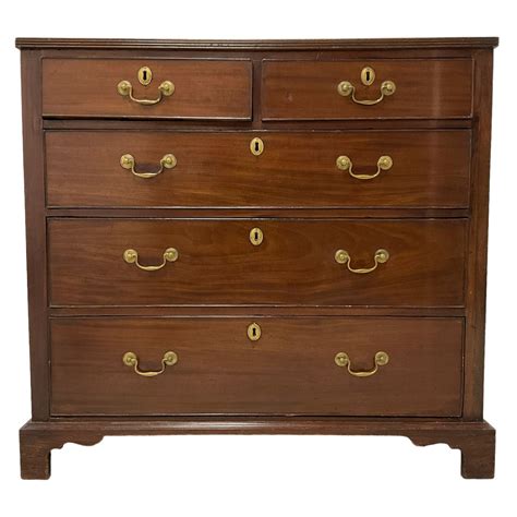 A George III mahogany chest the applied moulded edge top above …