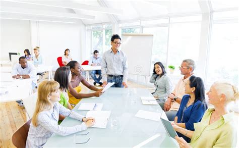 A Group of People Having a Meeting in the Office - Canva