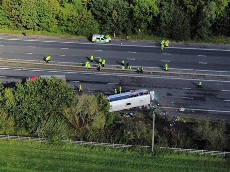A bus carrying dozens of schoolchildren overturns in northwest England, seriously injuring 1 person