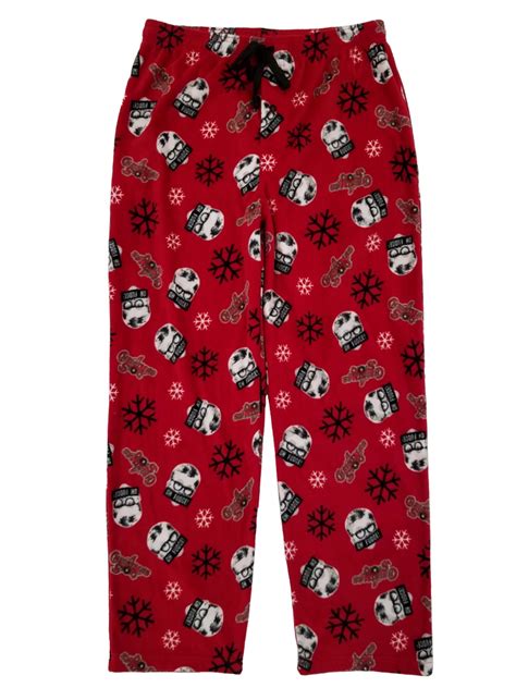 Embrace the holiday season with these Christmas Story sleep pants. An image of Raplhie's face appears on a red bull's eye on the left leg of these pants. Black text circles the target and reads, “You'll shoot your eye out, kid.” The pants come in graphite heather and have an adjustable waistband and a pair of pockets. . 