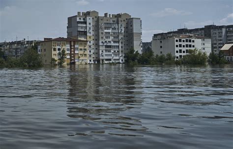 A dam collapses and thousands face the deluge  –  often with no help  –  in Russian-occupied Ukraine