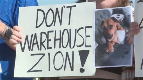 A dog is locked up, and these protesters want him freed