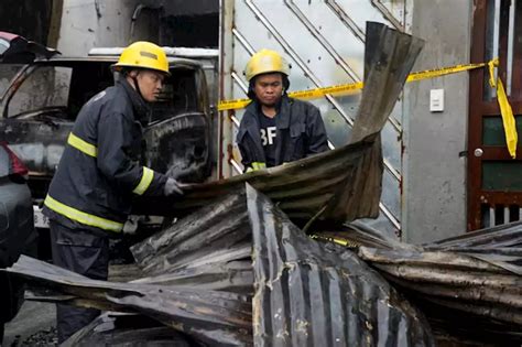 A fire kills 15 in a Philippine factory, where rains and a wrong address delayed firefighters
