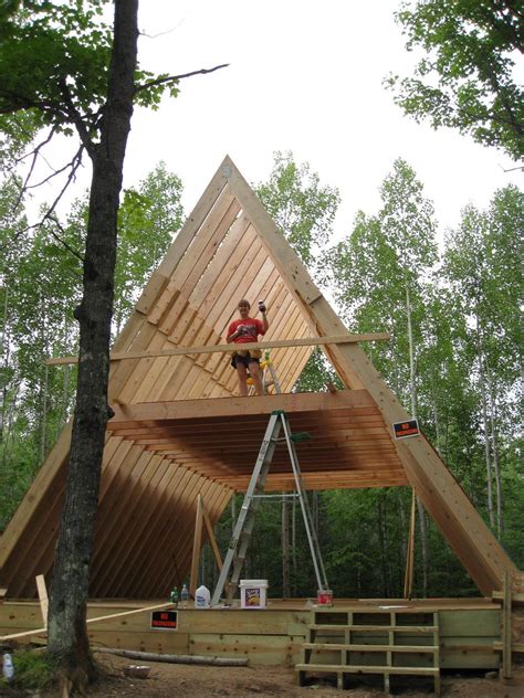 A frame house framing. An A-frame house (especially one with a metal roof) avoids dangerous snow buildup with the power of gravity. In rainy seasons or climates, however, pay attention to the grading around the house. 