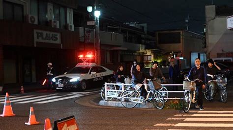 A gunman holed up at a Japanese post office may be linked to an earlier shooting in a hospital
