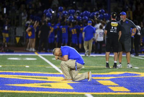 A high school football coach who won his job back after the Supreme Court ruled he could pray on the field has resigned