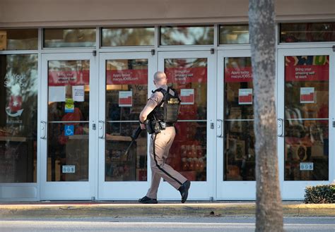 A man is killed and a woman injured in a 'targeted' afternoon shooting at a Florida shopping mall