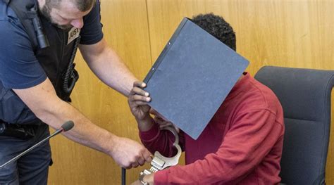 A man who attacked 2 girls with a knife in Germany and killed 1 is sentenced to life in prison