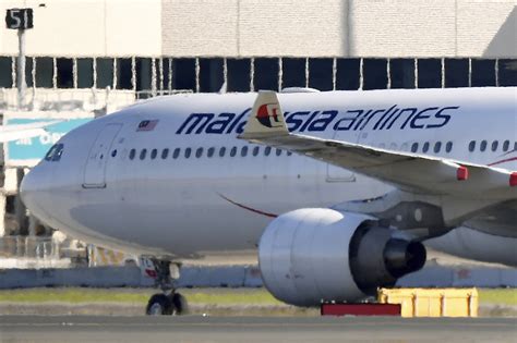 A passenger is charged in Australia with threatening to blow up an airliner