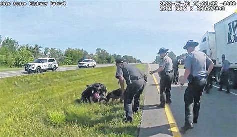 A police dog attacked a Black trucker on his knees. An Ohio city is dealing with the aftermath