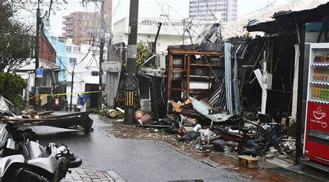 A powerful typhoon pounds Japan’s Okinawa and injures more than 20 people as it moves toward China