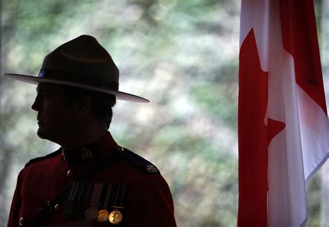 A retired Canadian policeman has been charged with helping China intimidate someone