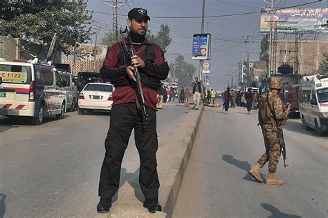 A roadside bombing in the commercial center of Pakistan’s Peshawar city wounds at least 3 people