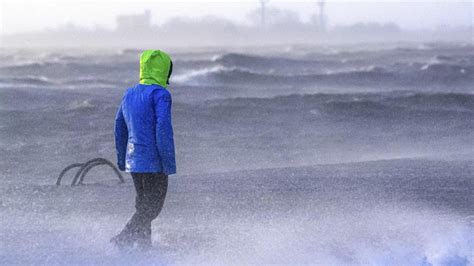 A storm brings strong winds to northern Europe, killing 2 people and disrupting transport