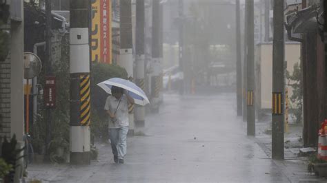 A strong tropical storm is lashing parts of Japan and disrupting holiday travel