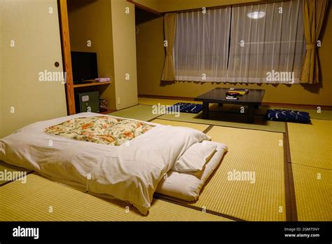 A traditional Japanese inn typically including tatami-matted rooms ...