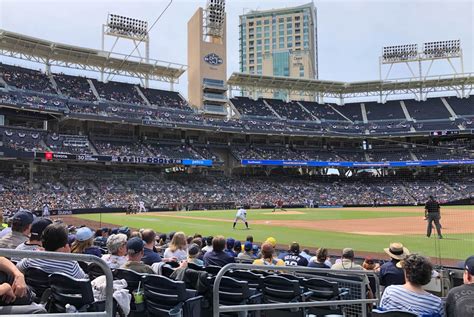 The Bud Patio features bar-style seating with a long table top that stretches across the entire row. Signage for Bud Patio in the right field of Petco Park. The scoreboard in right field is located just above sections 227-235 at Petco Park. The left field scoreboard at Petco Park is located right above sections 226-230..