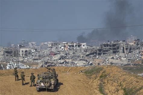 A weekend of combat in Gaza kills 14 Israeli soldiers as public support for the war is tested