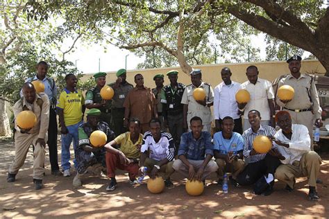 AMISOM POLICE HANDS OVER FOOTBALLS TO YOUTH IN BAIDOA