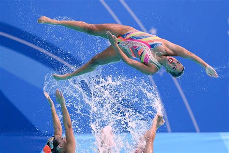 AP PHOTOS: Pan American Games feature diving runner, flying swimmer, joyful athletes in last week