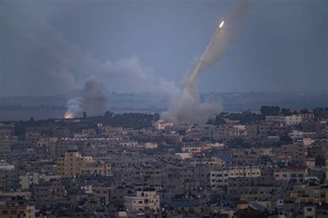 AP PHOTOS: Rockets sail and tanks roll in Israeli-Palestinian war’s 5th day